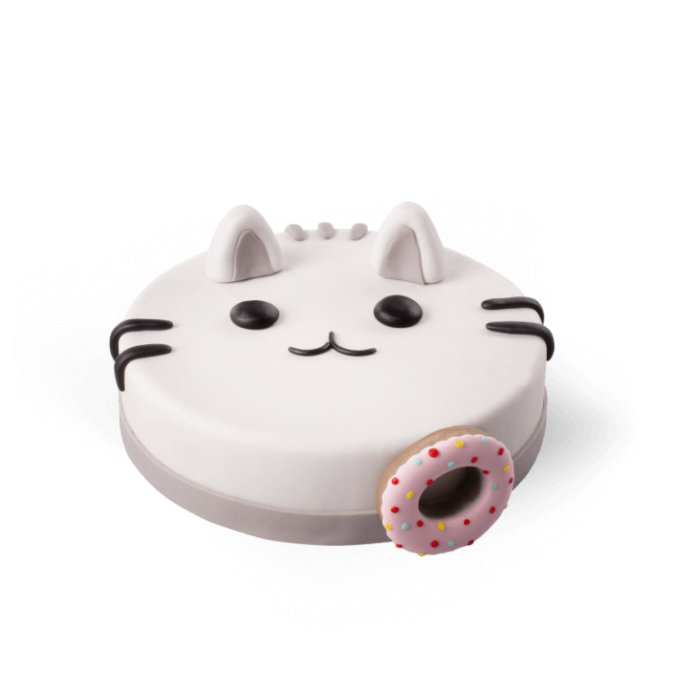 Kitten with a donut cake